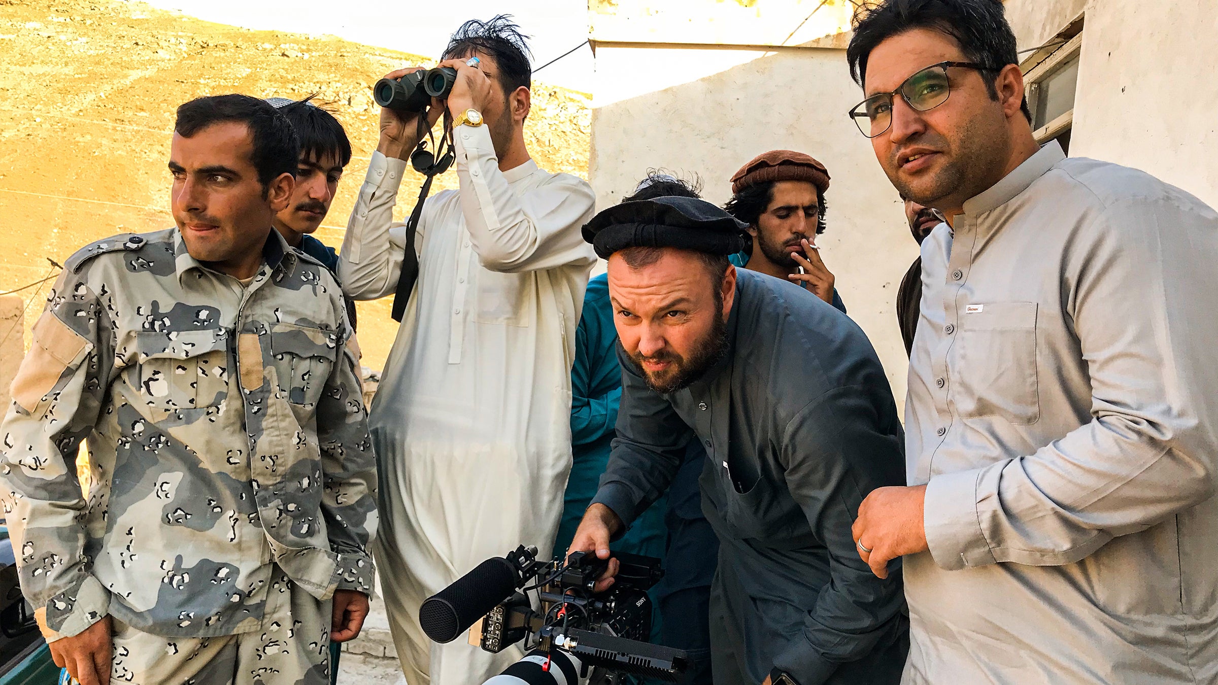 Aziz Tassal and Mark Oltmanns filming at frontline Afghan police outpost in Wardak province, August 2020