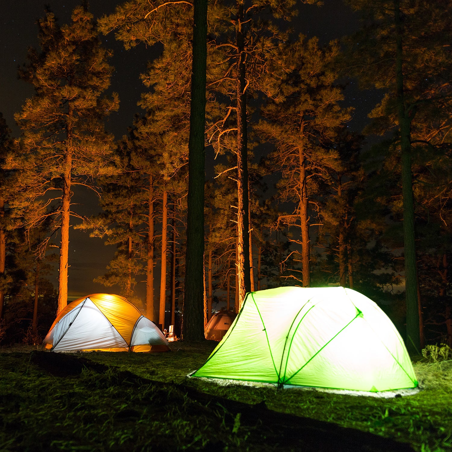 https://cdn.outsideonline.com/wp-content/uploads/2021/08/tents-lights-woods-camping_s.jpg