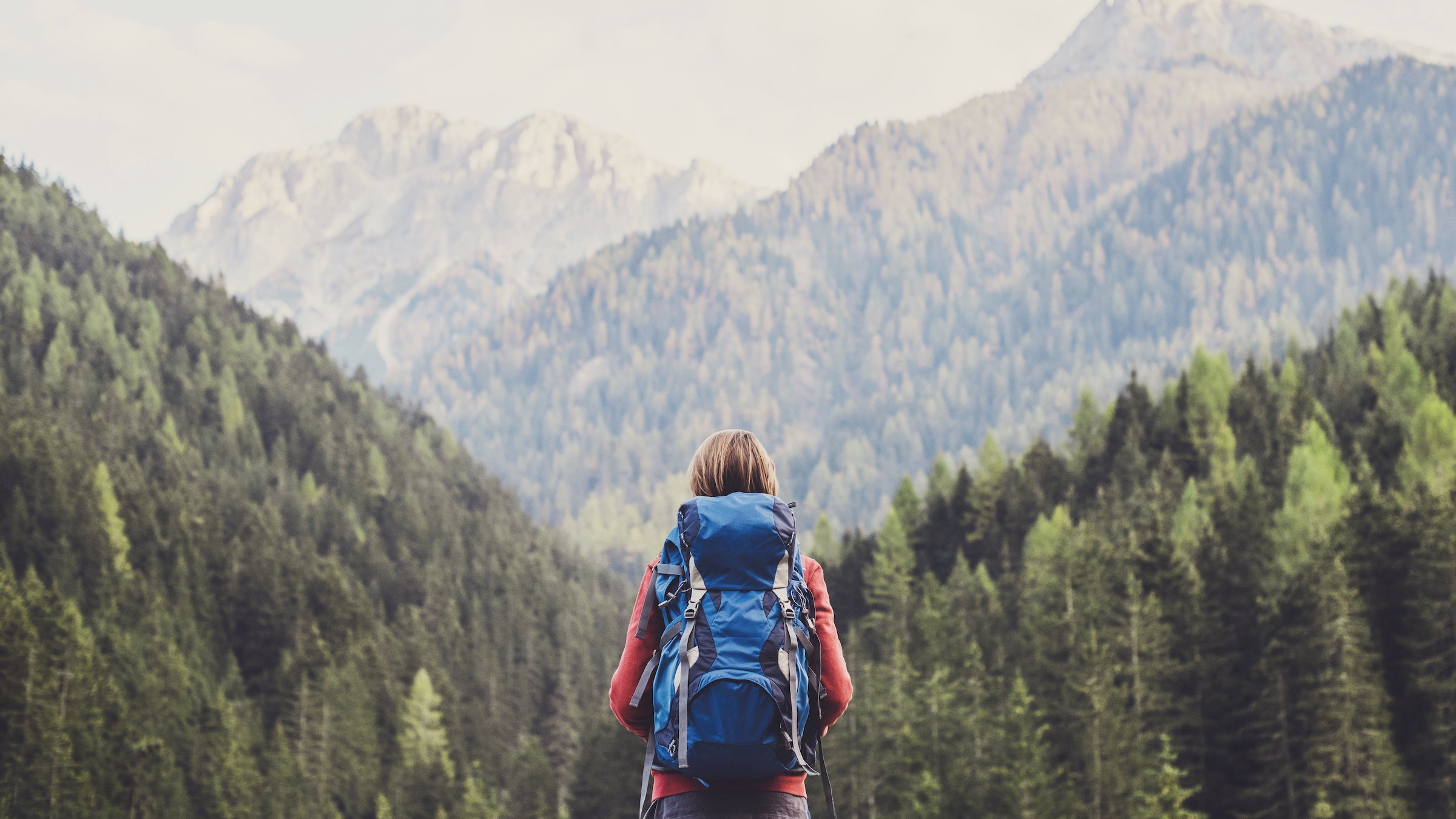 woman backpacking in mountains