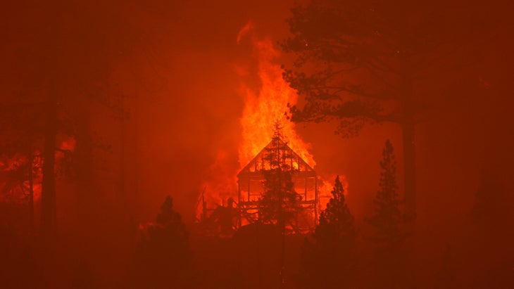 The Caldor Fire burns homes along a ridge on August 30, 2021 near South Lake Tahoe, California. 