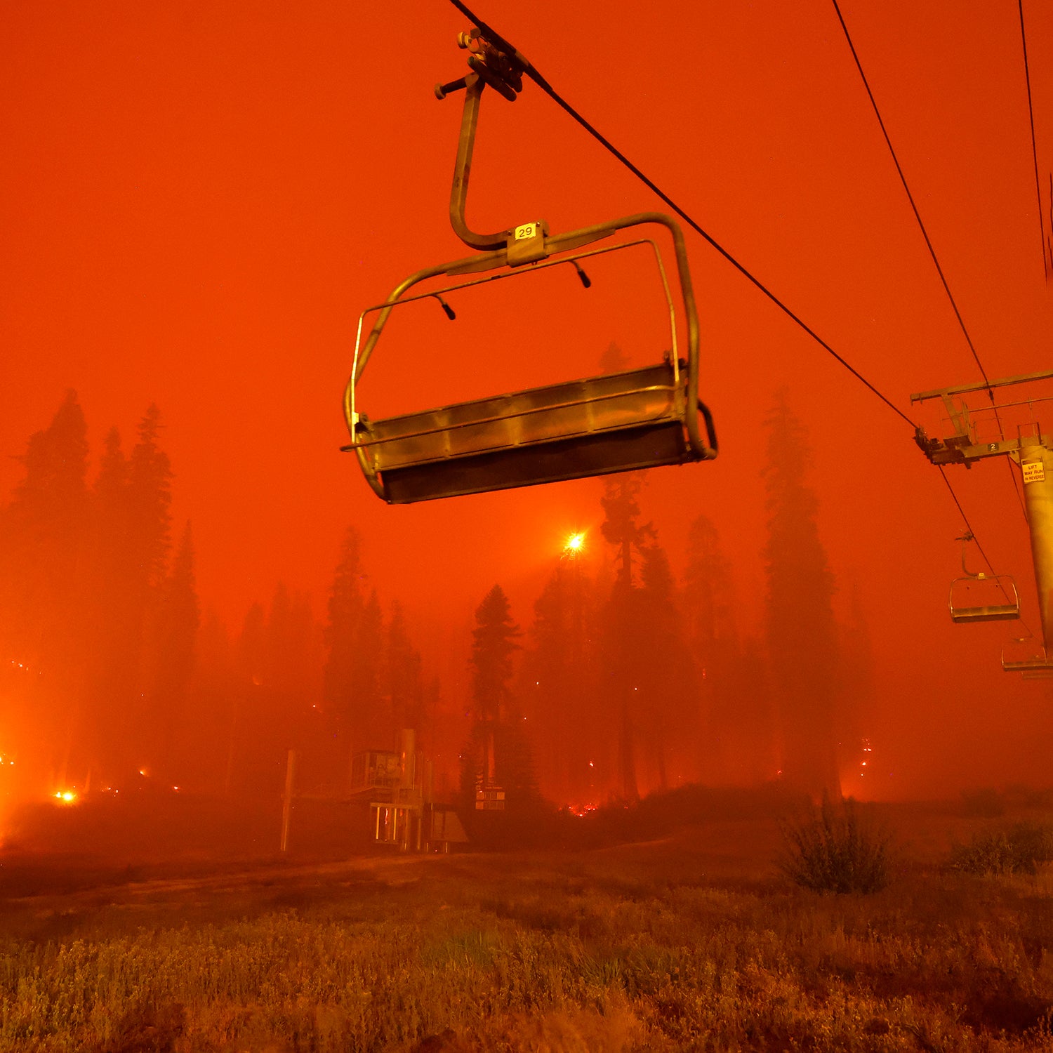 A chairlift at Sierra-at Tahoe ski resort sits idle as the Caldor Fire moves through the area on August 30, 2021 in Twin Bridges, California.