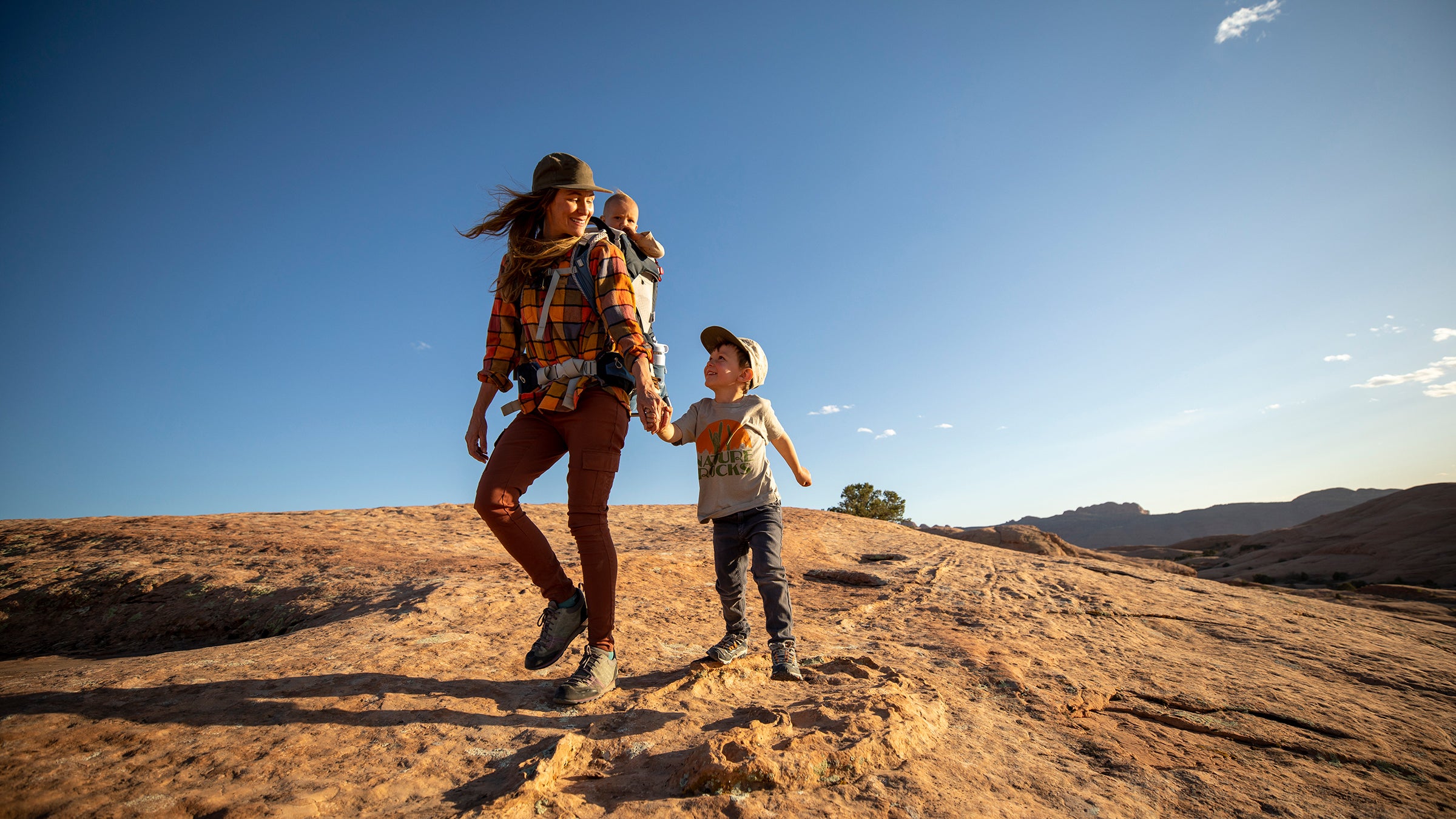 A mother and hiking with her two kids