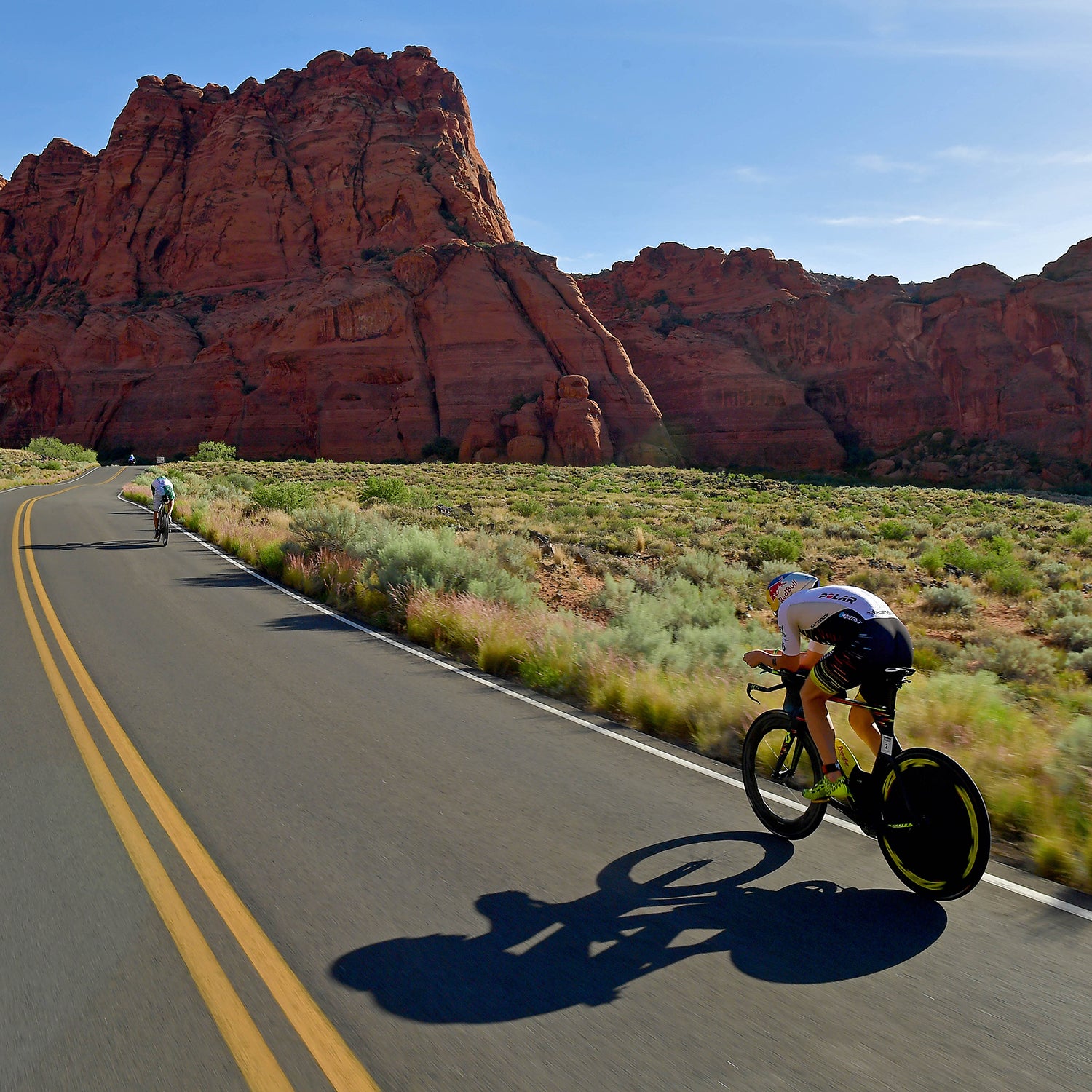 Sebastien Kienle of Germany chases Lionel Sanders of Canada on the bike during the IRONMAN 70.3 St George Utah on May 5, 2018 in St George, Utah.