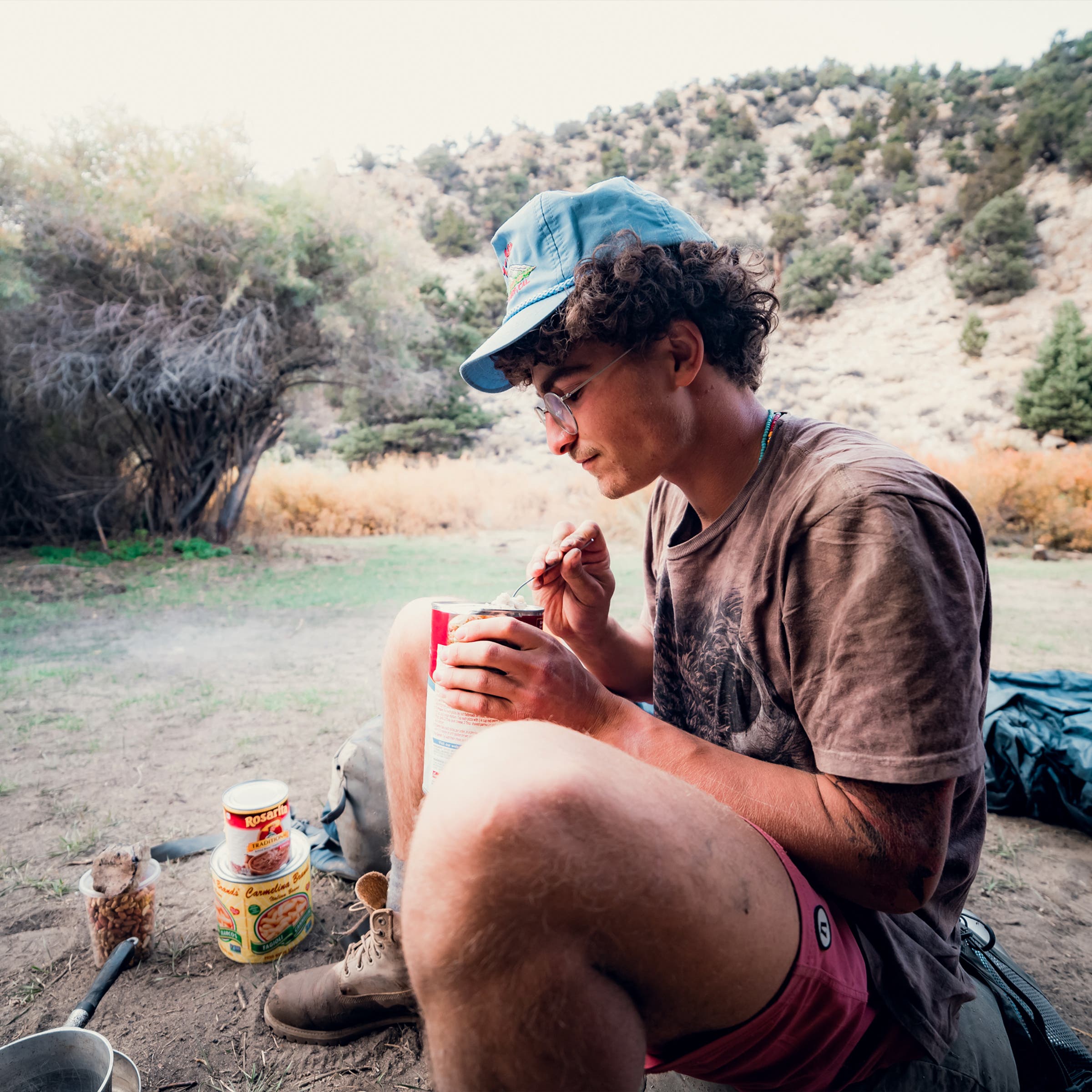 Nathan Becker enjoying some cream of mushroom soup on a backpacking trip up Wyman Creek