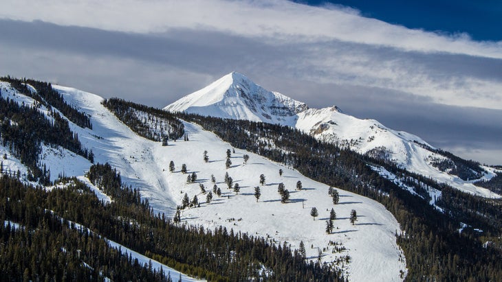 Lone Peak and the surrounding Big Sky Resort covered in snow during November.