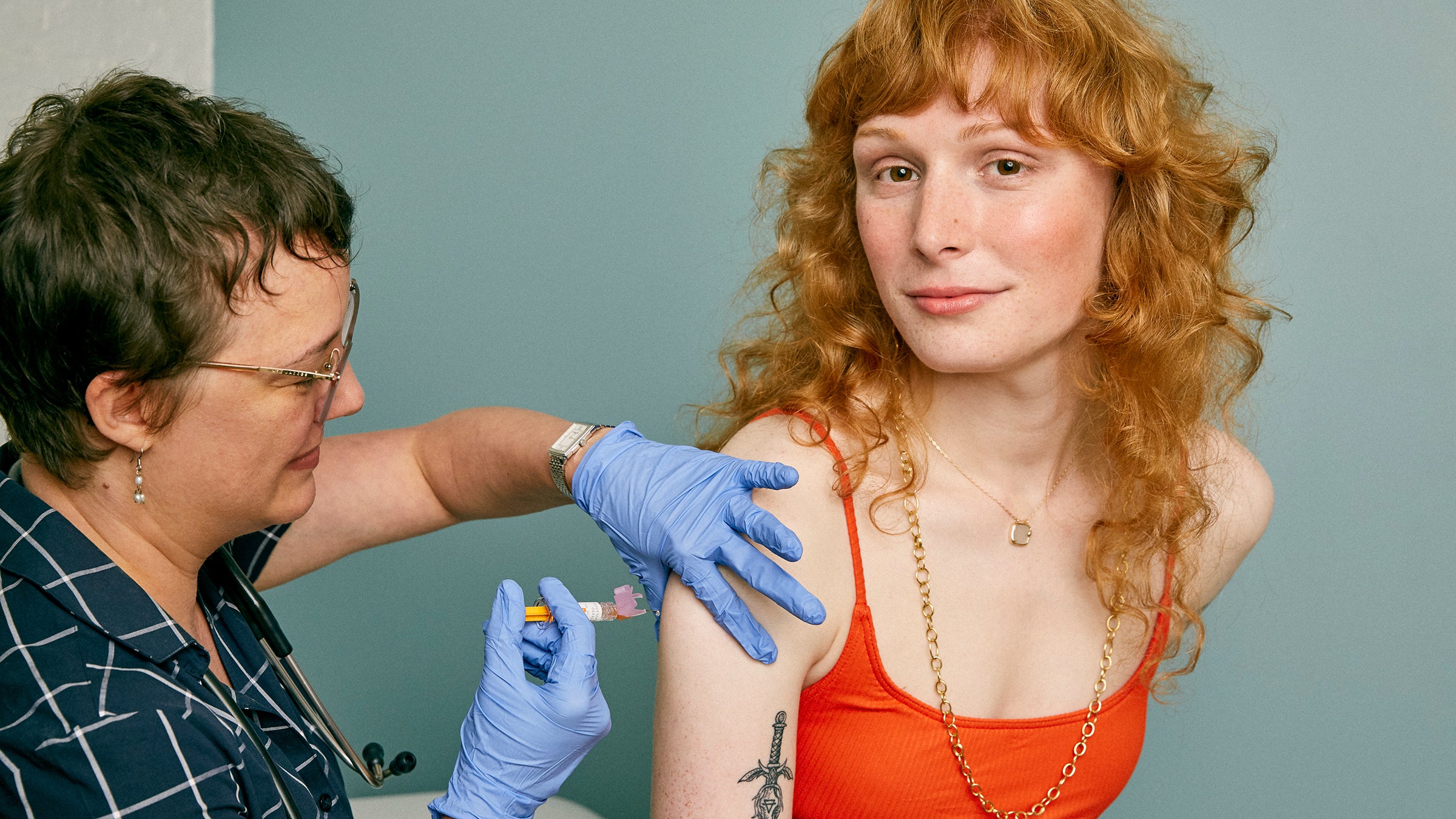 Woman receiving a vaccine in a doctor's office