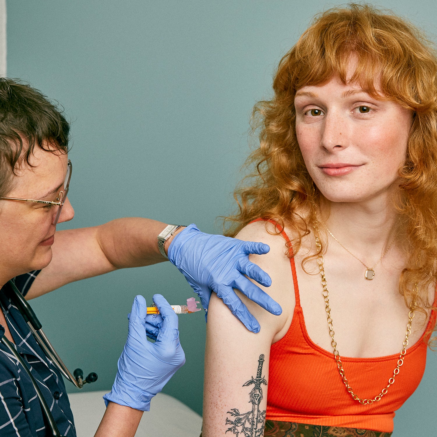 Woman receiving a vaccine in a doctor's office