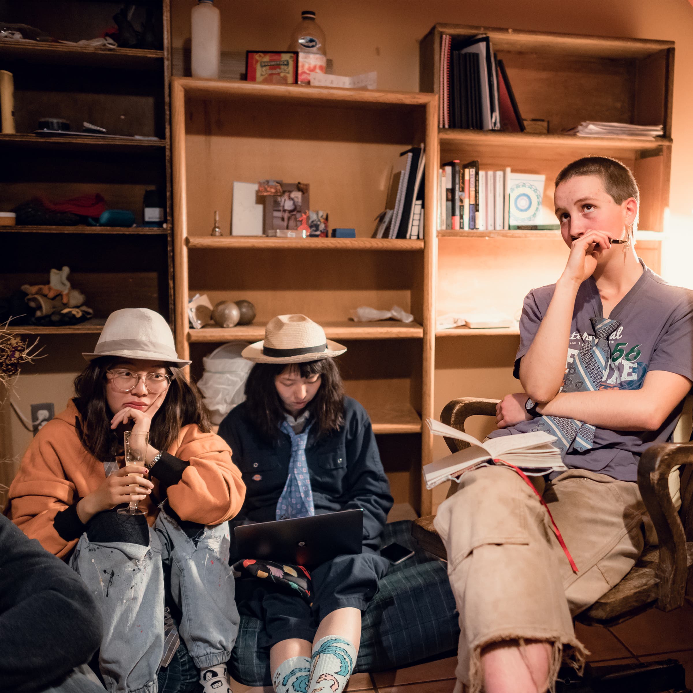 Amelia Ding, Chen Li, and Rosemary Kelly pondering during a student-body meeting