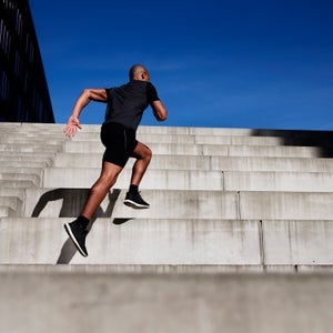 Man running up outdoor stairs