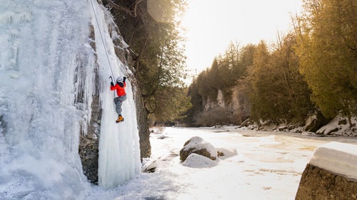 Ice climbing a frozen waterfall
