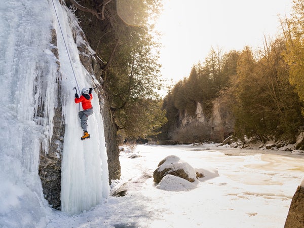 Ice climbing a frozen waterfall