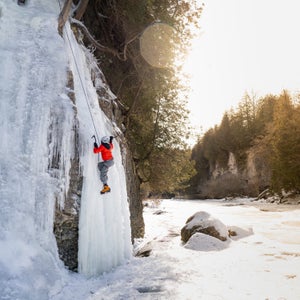 Ice climbing a frozen waterfall