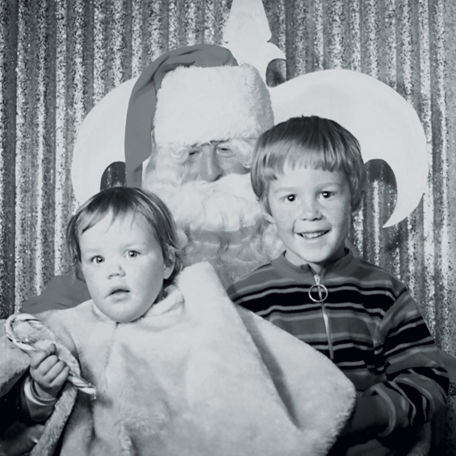 The author and her brother, Chris Ross, with Santa in 1972