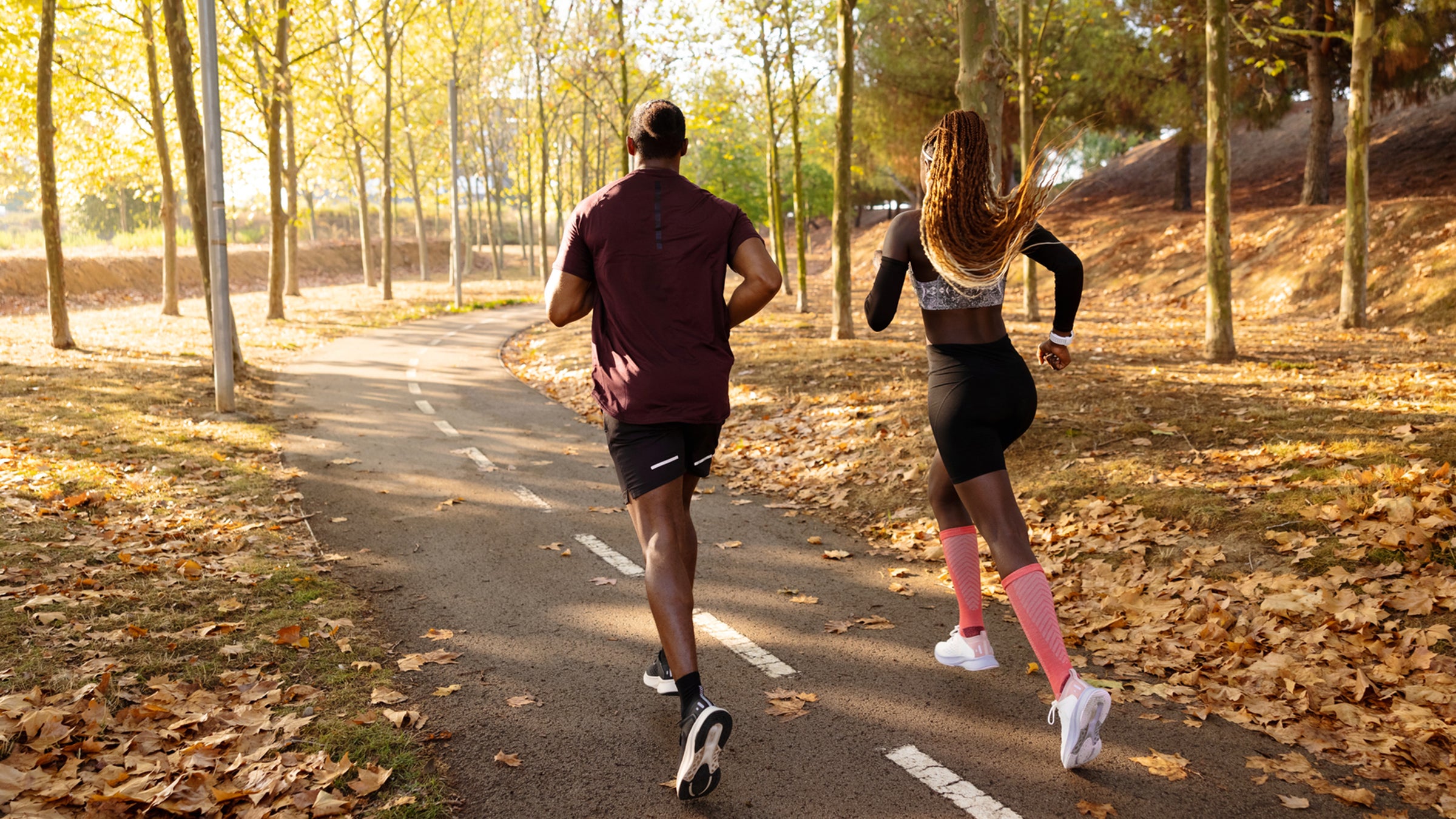 Athletes running through park