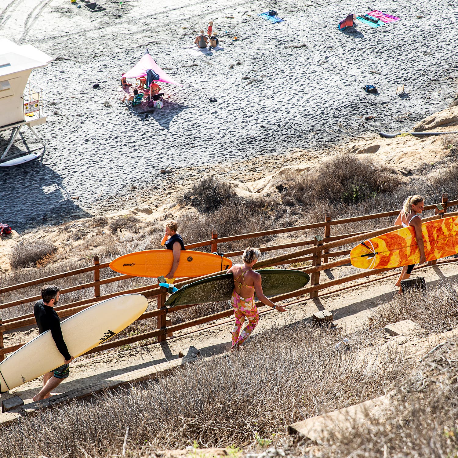 Surfers on the switchback trail to Beacon’s