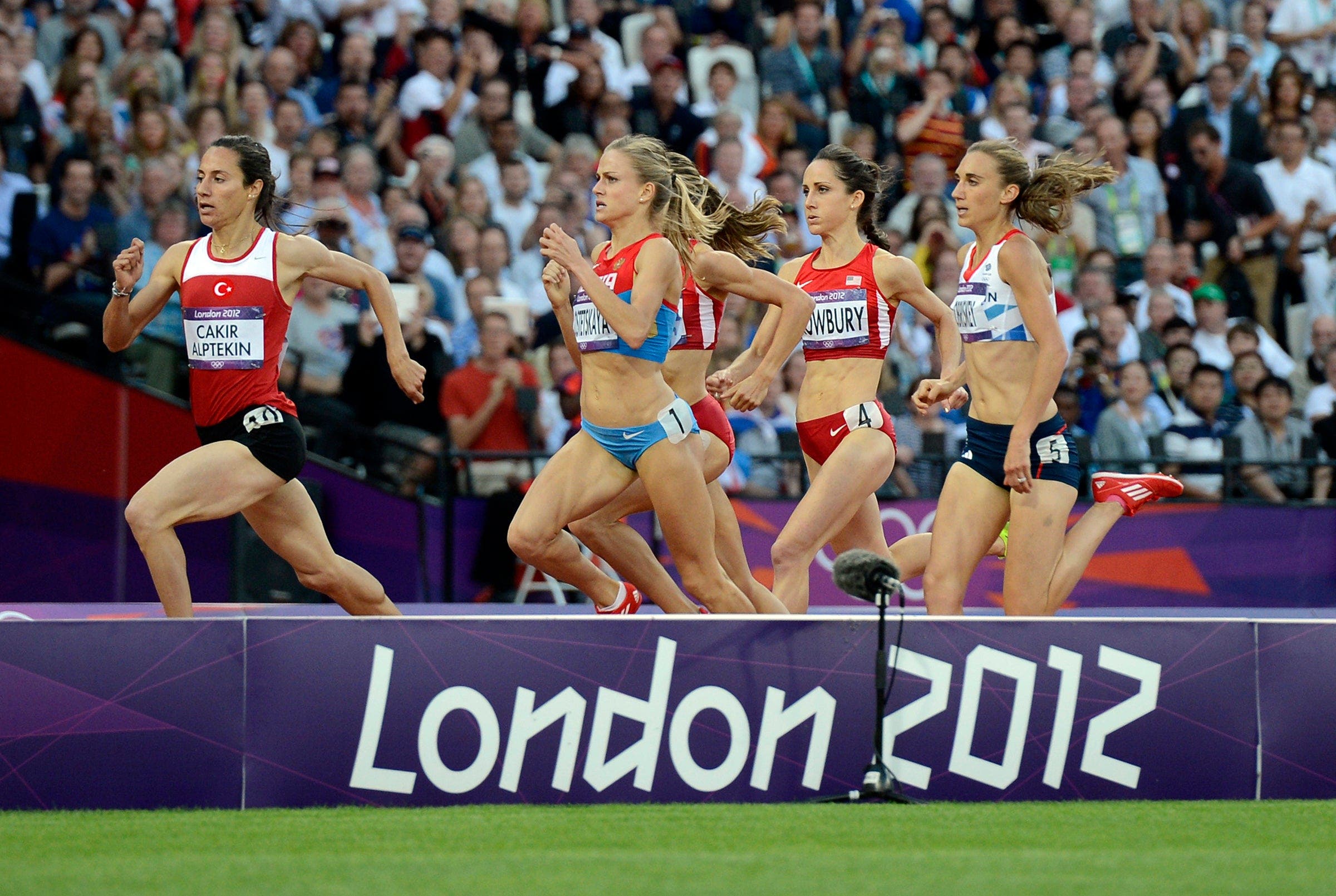Shannon Rowbury trails Asli Cakir and Ekaterina Kostetskaya, who both have since been disqualified for doping, in the women's 1500m semi-finals at the London 2012 Olympic Games on August 8, 2012 in London.