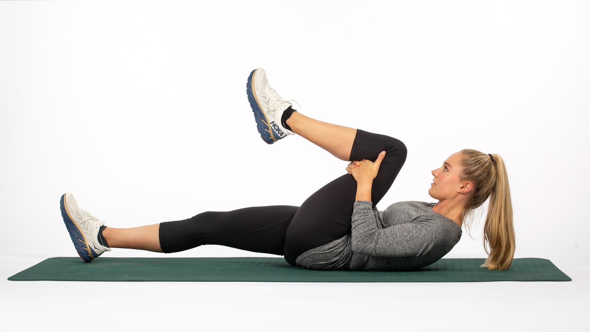 Runner performing the Pelvic Tilt Stretch