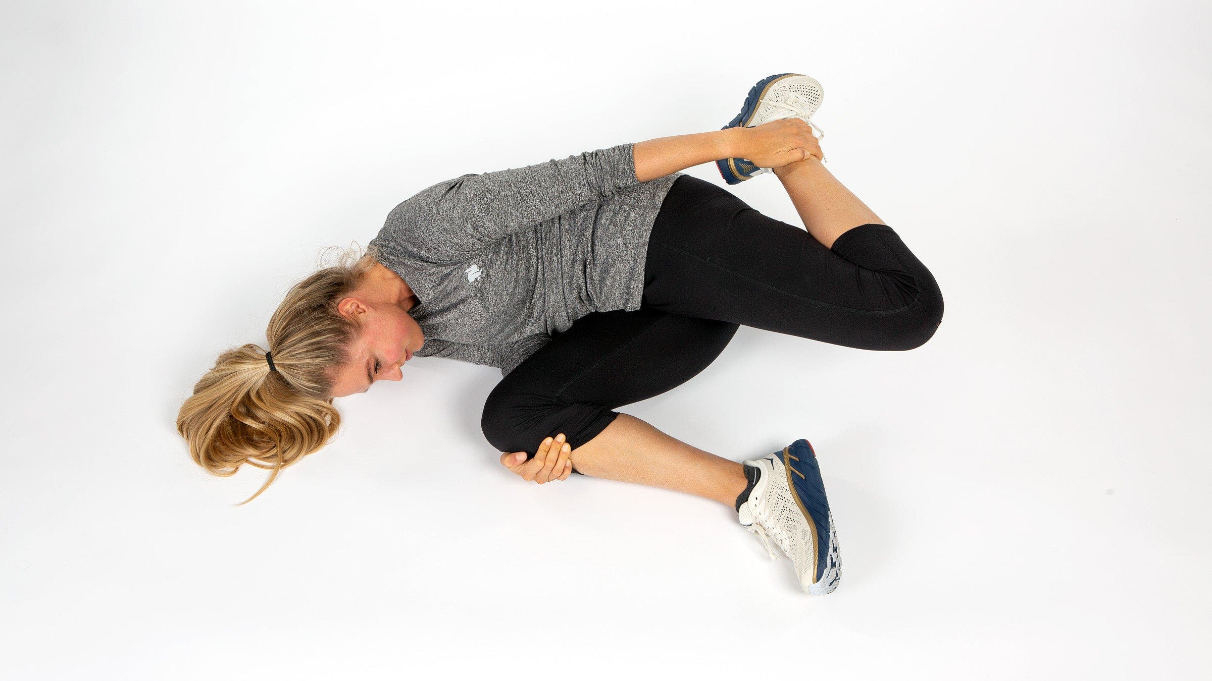 runner performing Quadricep Stretch