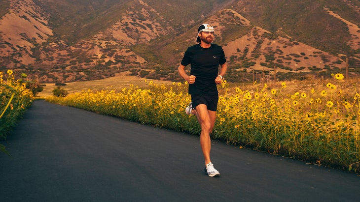 Jared Ward training amid sunflowers on bike trail near his home in Utah.