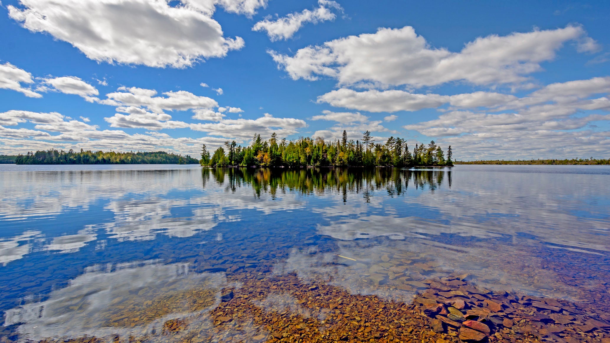 Sunny reflections on Kekekabic Lake in the Boundary Waters