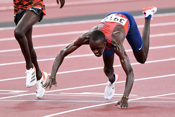 USAs Paul Chelimo falls across the finish line to win the bronze medal in the mens 5000m race at the 2020 Tokyo Olympics. 