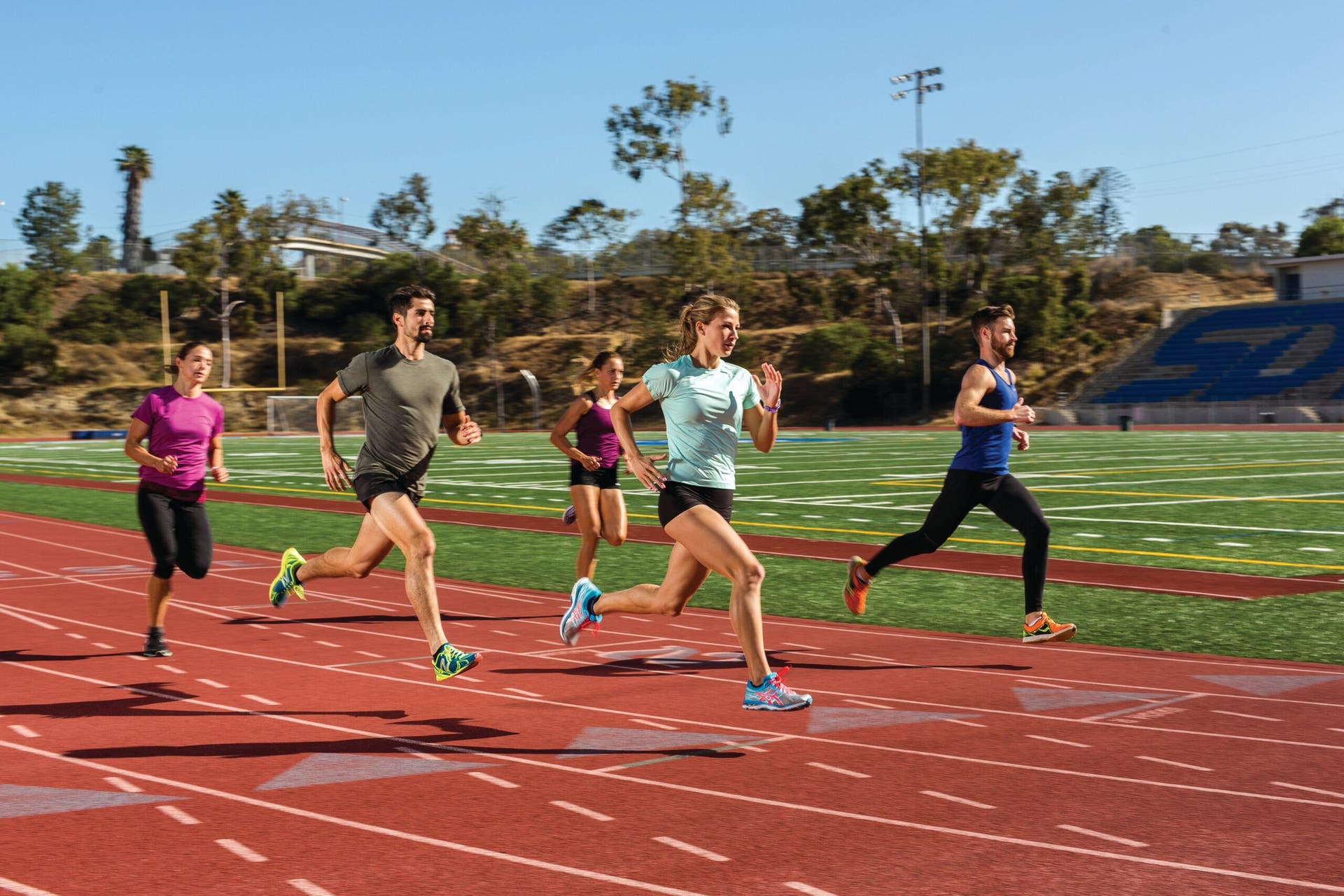 group of runner training on track