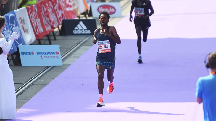Derara Hurisa finishing first in the 2021 Vienna Marathon before being disqualified for wearing too-thick shoes.