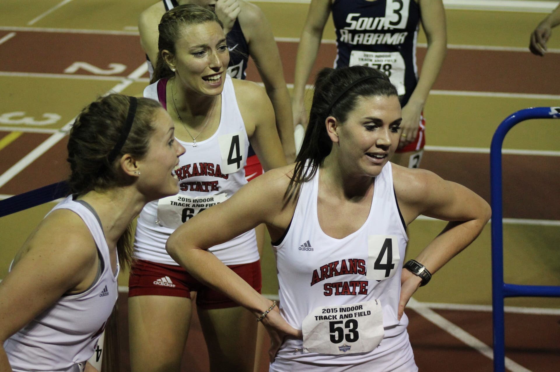 Teammates celebrate a relay PR