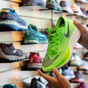 nike next racing shoe on wall, featuring comfortable fit, cushion under foot, energy return