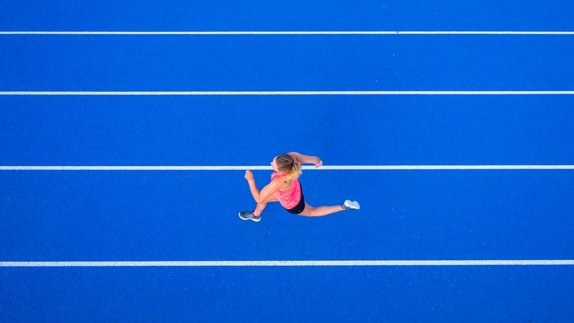 Top view of woman runner doing the Michigan Workout (probably).