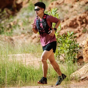 Man running on trail.