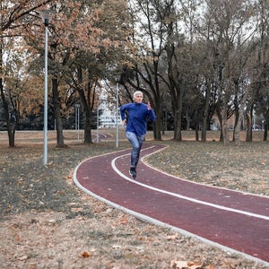 Active senior woman enjoying a healthy lifestyle, doing strides, and living her best life.
