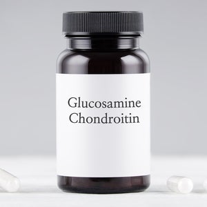 nutritional supplement glucosamine and chondroitin bottle and capsules