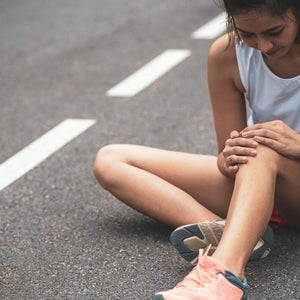 Sport injury, Women has knee pain during outdoor exercise. Sports running knee injury in women runner.