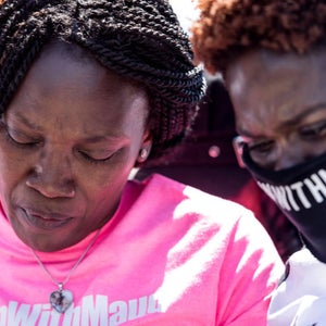 Mother and sister of Ahmaud Arbery comfort one another