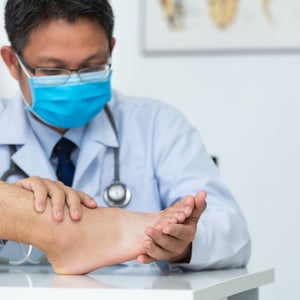 doctor examining foot for injury