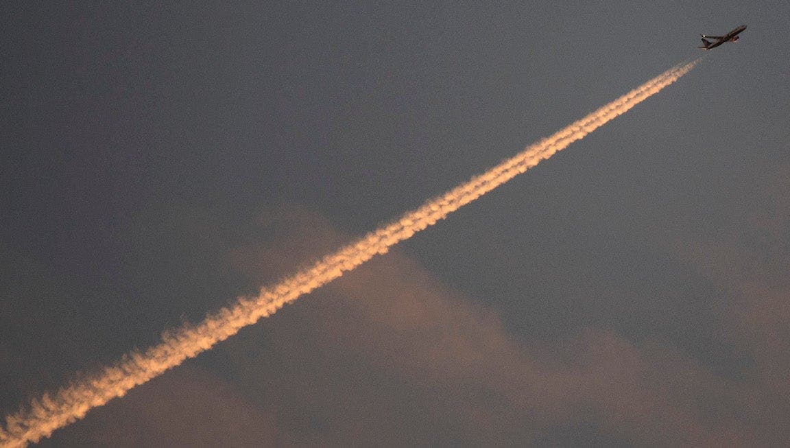 An airplane producing vapor trails.