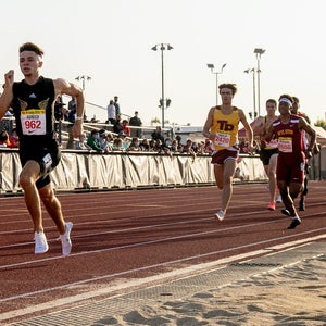 High school boys racing at track meet in California.