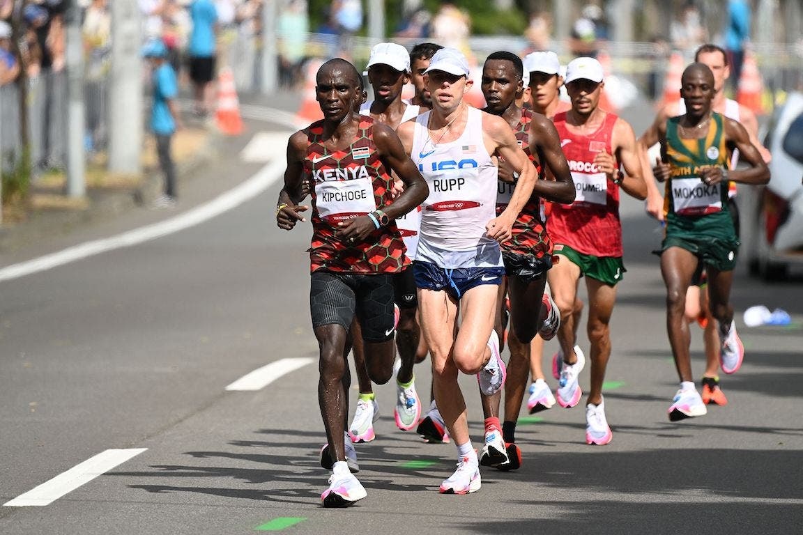 Kenya's Eliud Kipchoge takes the lead as he competes in the men's marathon final, Galen Rupp (USA) is pictured right behind him.