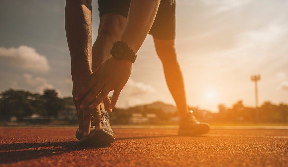 The young man wore all parts of his body to prepare for jogging on the running track around the football field.