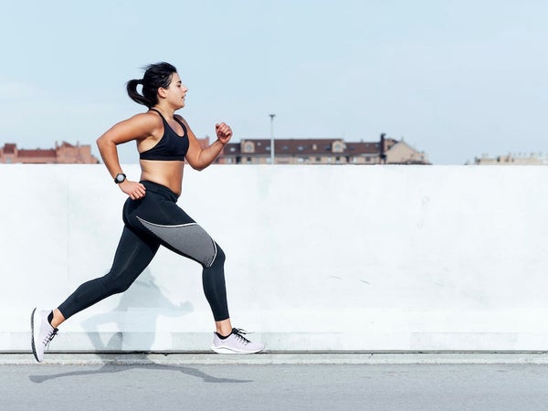 Young woman running training in the city.