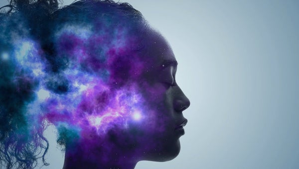 Woman in meditation with galaxy in head.