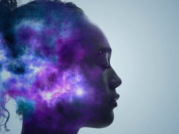 Woman in meditation with galaxy in head.