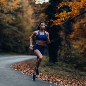Woman running outdoors in the fall.