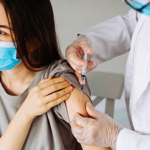 Closeup of a nervous woman and her doctor