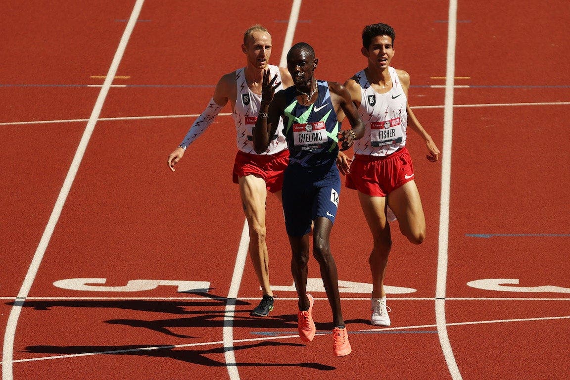 Top three finishers in the men's 5k cross the line at the Olympic Trials brush close to breaking track rules
