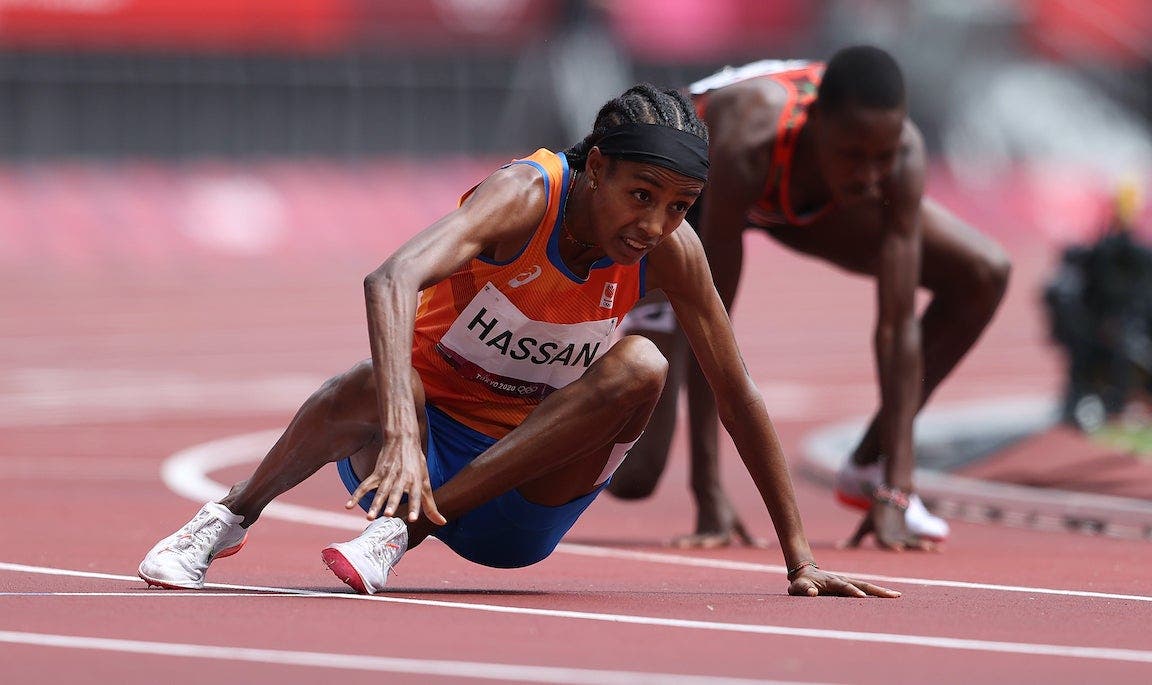 Sifan Hassan getting up off the track after falling in her heat of the 1500.