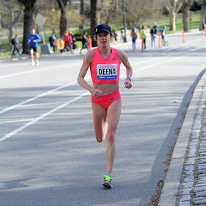 Deena Kastor racing on road marathon in pink kit.
