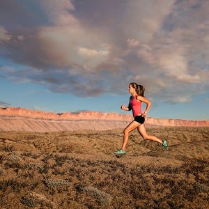 Woman trail running in desert, Grand Junction, Colorado, USA.
