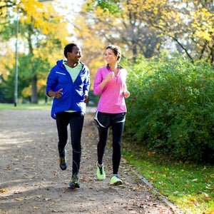 Couple jogging in park.